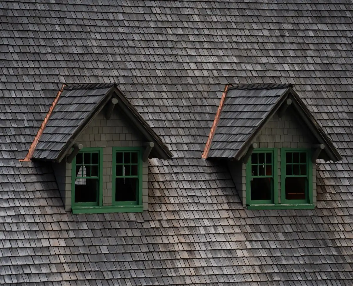 Dormers on a shingle roof in Ontario, CA, where step flashing and kickout flashing carry water past the walls